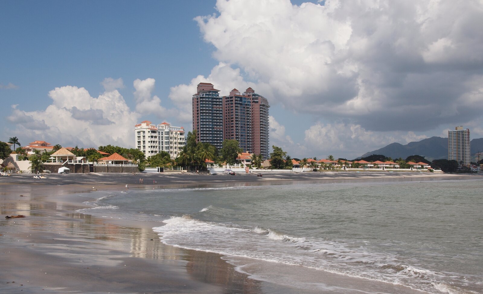 Bands of dark and light sand on Playa Coronado, Panama, with the sea behind